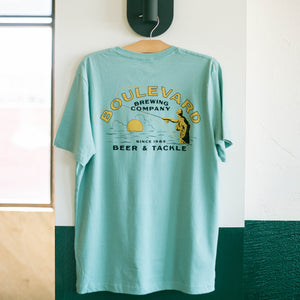 The back of a light blue t-shirt depicting a fisherman, that says, "Boulevard Brewing Company, Since 1989, Beer & Tackle".