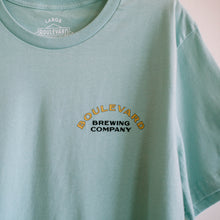 Load image into Gallery viewer, The fron t of a light blue t-shirt that says Boulevard Brewing Company in the upper right side.
