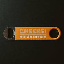 Load image into Gallery viewer, orange paddle style bottle opener with &quot;CHEERS! BOULEVARD BREWING CO&quot;
