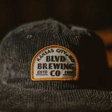Load image into Gallery viewer, A close up of the white patch on a black hat.
