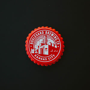 A red bottle cap brewery magnet