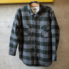 Load image into Gallery viewer, A black and grey plaid jacket with sherpa lining, hanging up.

