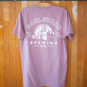 The back of a light purple t-shirt, featuring a white brewery logo.