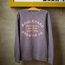 Load image into Gallery viewer, A plum crewneck with the words, &quot;Boulevard Brewing Co. Kansas City, Missouri, Since 1989&quot; in pink lettering.
