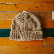 Load image into Gallery viewer, A khaki-colored waffle knit beanie.

