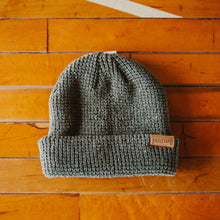 Load image into Gallery viewer, A green waffle knit beanie.
