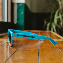 Load image into Gallery viewer, The side view of the blue Boulevard Sunglasses.
