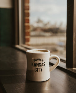 Brewed in KC Mug side with coffee