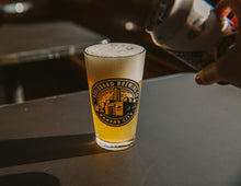 Load image into Gallery viewer, Circle Brewery Logo Pint Glass with beer pouring
