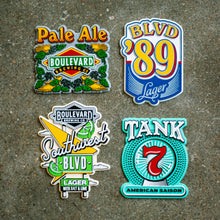 Load image into Gallery viewer, All four of our varieties of Beer magnets on a grey background.
