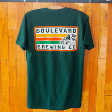Load image into Gallery viewer, The back of a green t-shirt that says Boulevard Brewing Co. &#39;89 with a picture of the brewery and yellow, orange, and green stripes in a rectangle.

