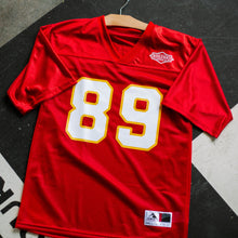 Load image into Gallery viewer, 89 football jersey photographed on the ground.
