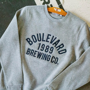 grey crewneck sweatshirt with embroidered "Boulevard 1989 Brewing Co."
