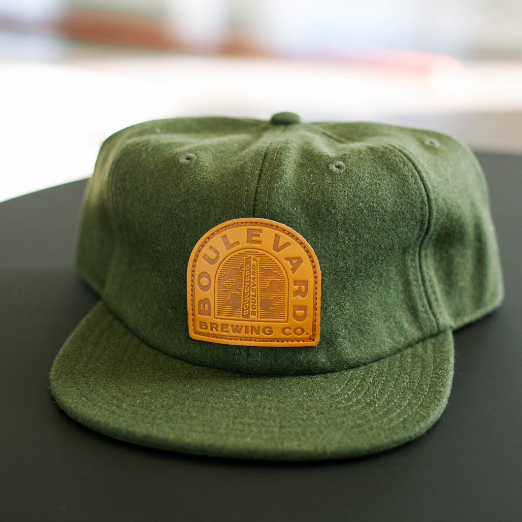 green wool flat brim hat with sewn on 