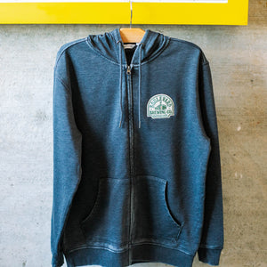 A heather grey zip-up hoodie with a die-cut patch