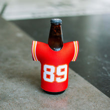 Load image into Gallery viewer, The back of the red 89 Football jersey koolie on a beer, depicting a white 89. 
