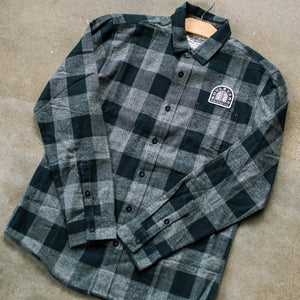 A flat lay of the back and grey check Arch Lagerman Check Button-Up