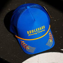 Load image into Gallery viewer, Blue cap with 'Boulevard Brewing Company' logo on a dark surface
