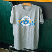 Load image into Gallery viewer, Gray t-shirt with 'BLVD Beer' logo on a hanger against a green wall.
