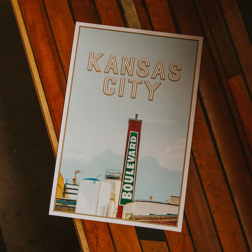 Kansas City Boulevard Smokestack poster laying on wood.