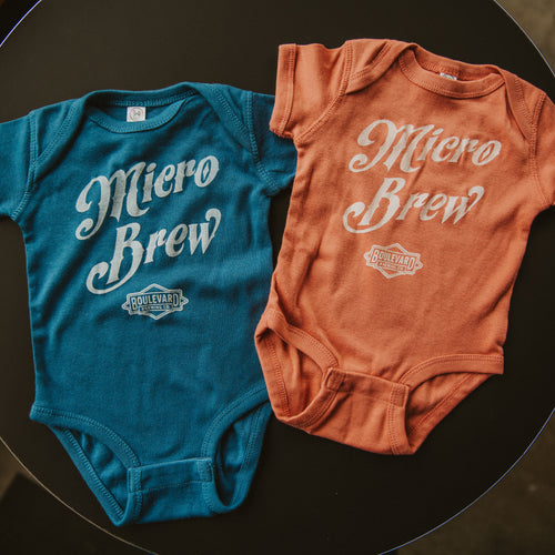 Blue and pink baby onesies with 