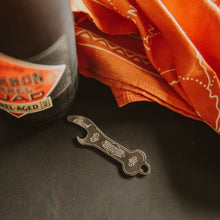 Load image into Gallery viewer, Keychain opener with engraved Boulevard Brewing Co. diamond logo. Also pictured beer bottle and bandana.
