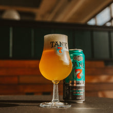 Load image into Gallery viewer, Tulip style glass with &quot; Tank 7&quot; filled with beer next to Tank 7 tall boy can
