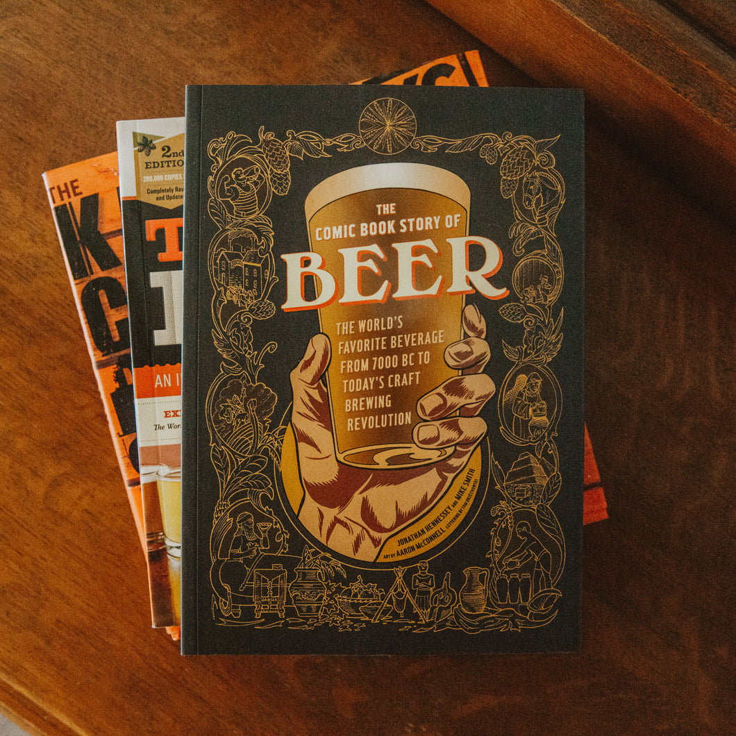 Comic Book Story of Beer Cover on table of books
