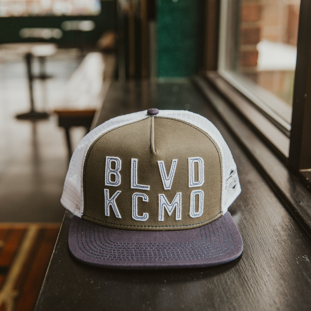 BLVD KCMO Snapback front sitting on table