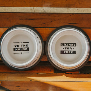 2 dog bowls with "On the House" or "Drinks for Free"