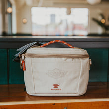 Load image into Gallery viewer, A tan Boulevard Takeout Cooler with an orange rope handle.

