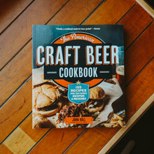 Load image into Gallery viewer, A cookbook titled The American Craft Beer Cookbook resting on a table.
