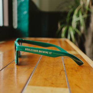 A side view of the green Boulevard Sunglasses.